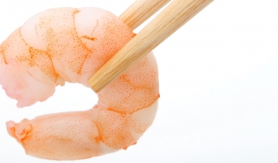 Shrimp being held by chopsticks